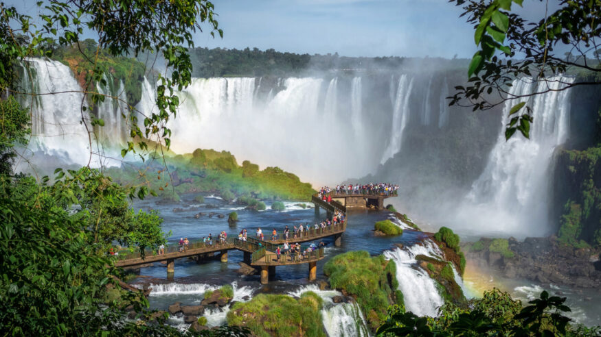 Tourists exploring Iguazu Falls on the border of Brazil and Argentina.