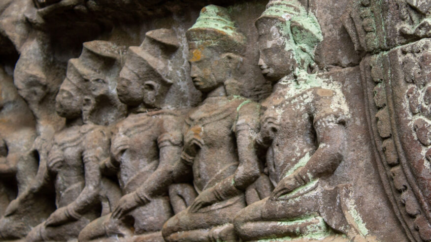 The Angkor Wat temple wall with god sculptures, Cambodia