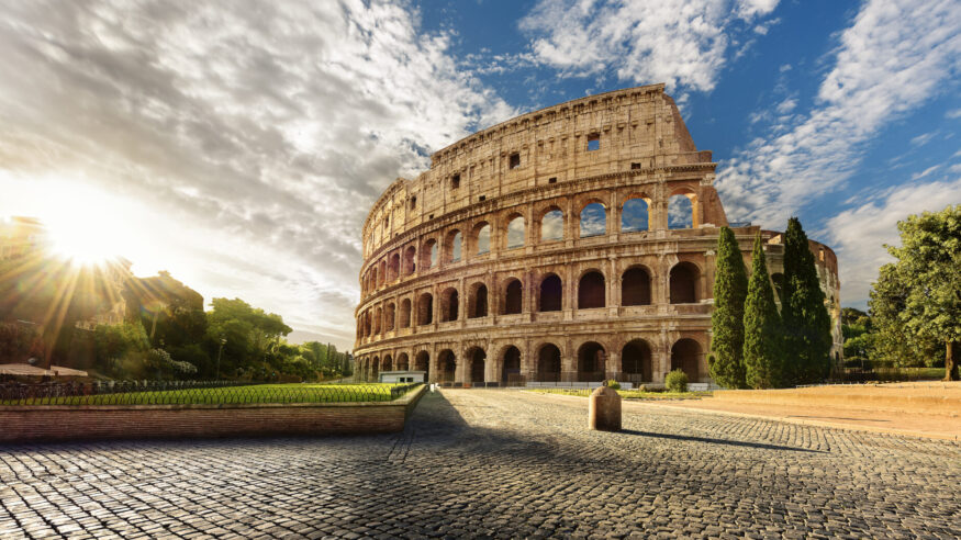 Colosseum in Rome and morning sun, Italy