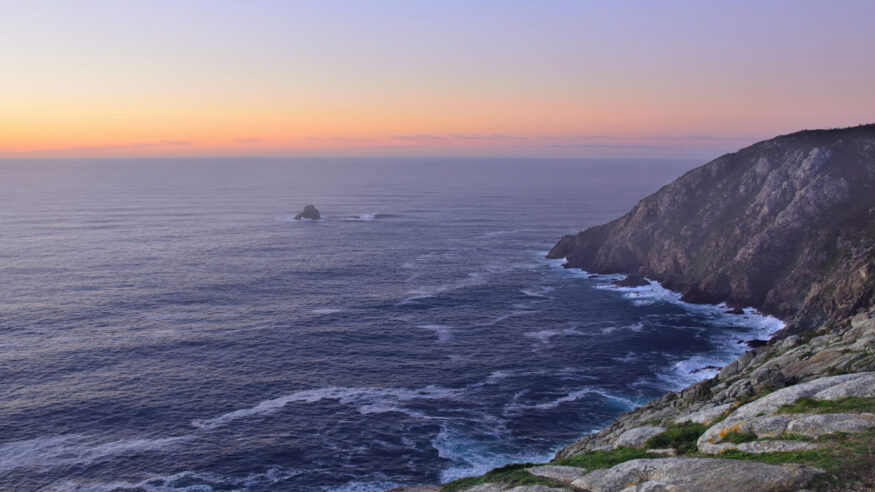 Sunset in Finisterre Cape. Final Step in the Camino de Santiago. Costa da Morte. Galicia. Spain